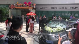 Bridegroom Carries Bride into the Car in China