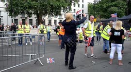 Man in Trump mask dances at Free Tommy protest