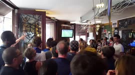 In a Paris pub French fans watch the final few minutes of the World Cup and begin to celebrate their victory!