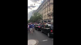 People are celebrating with car drivers on the street of paris