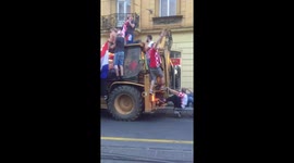 Croatia fans cruise down street on bulldozer to celebrate second place in World Cup