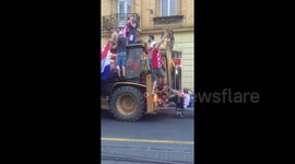 Croatia fans cruise down street on bulldozer to celebrate second place in World Cup
