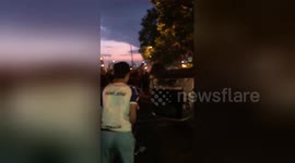 Out-of-control fans in Paris overturn car as World Cup celebrations erupt into chaos