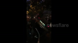 Out-of-control fans in Paris overturn car as World Cup celebrations erupt into chaos
