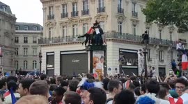 France fans spin on advertising column after final victory