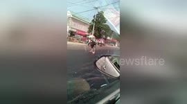 It's so hot in China that a man got stuck in melted tarmac trying to cross the road