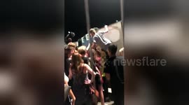 Fans wait 'several hours' after Eminem concert to collect bags