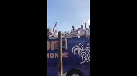 French players greet fans with World Cup trophy during victory parade