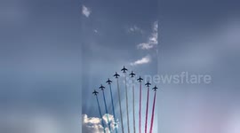 French jets greet fans with red, white and blue smoke during World Cup victory parade