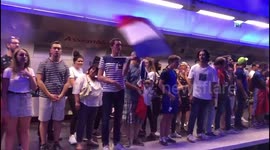 French fans break into chorus of La Marseillaise while waiting for train