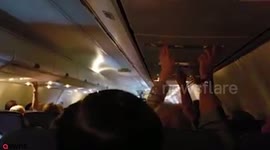 Newlyweds touched when air attendants hold special ceremony mid-flight to celebrate their marriage