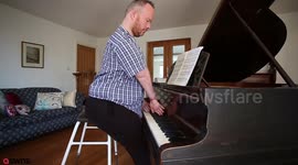 Man born without elbows defies odds by learning to play piano