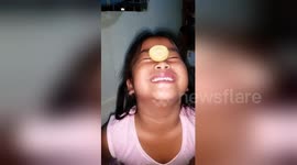 Little girl does 'biscuit challenge' but brother can't help cheating