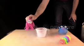Squishy pink toy tentacle octopus monster in Liquid Nitrogen smashed with hammer