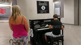 A man playing piano at Kind Cross Station