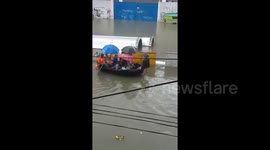 Motorists rescued by boat as tropical storm hits Philippines' Quezon City