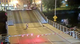 US cyclist ignores warning barriers and falls into drawbridge gap