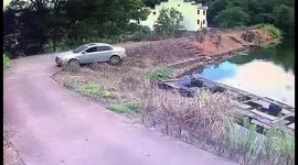 Driver forced to swim back to shore after reversing into reservoir