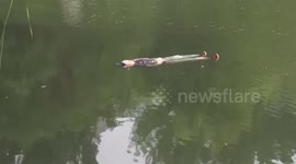 Eerily still woman floating on back while waiting for rescue goes viral in China