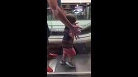 baby boy on escalators