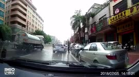 Cute Chinese couple jump up in unison to avoid sprinkler