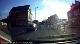Two on moped cross a Zebra crossing, and ride on pavement, Sale Moor