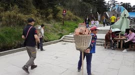 Chinese labourers hauling building materials