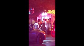 Crews help victims onto ambulance following Toronto shooting