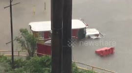 Jeepney passenger bus caught in flood in Philippines