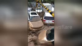 Cars swept away as flash floods surge through streets of Chinese city