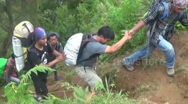 Disabled men conquer Indonesian mountain on crutches with help from friends