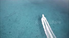 Drone chasing boat, spectacular aerial shots of the Bahamas waters