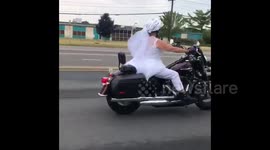 Bride rides Harley in her wedding dress on way to her ceremony