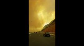Sky turns an eerie amber-orange as wildfire burns east of Athens