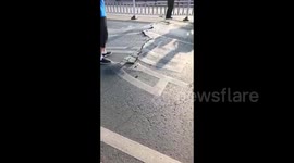 Heatwave in China causes bridge to buckle