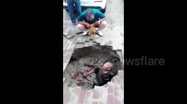 Elderly man crashes into sinkhole as ground collapses beneath him