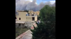 Smoke and flames from fires in Attica