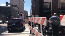 Police standing by in Kansas City in preparation for crowds of supporters and protestors waiting to catch a glimpse of the motorcade
