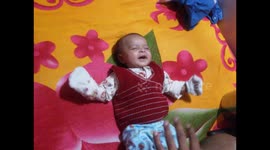 Baby girl laughing continuously with father