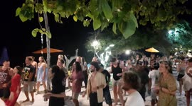Dancing to the music and party in Gili Trawangan beach, Lombok, Indonesia.