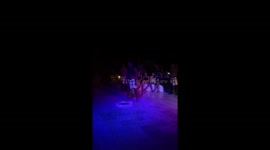 Crazy man walking on the broken glasses