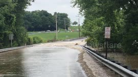 Road floods after creek breaks its banks during Central Pennsylvania storm