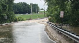 Road floods after creek breaks its banks during Central Pennsylvania storm