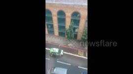 Londoners dance in rain after heavens open