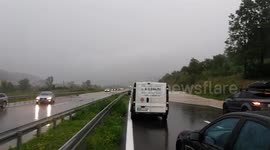 Traffic blockage due to huge rain and water spill over the highway