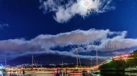 time-lapse of the blood moon eclipse developing and then setting over yachts and mountain in Tasmania