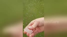 Giant hail stones rip tents at UK camping shop
