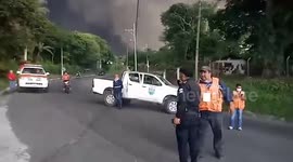 Villagers prepare to be evacuated from San Miguel Los Lotes during Volcan de Fuego's eruption