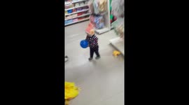Baby play with ball in a mall.