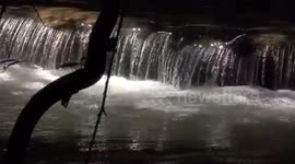 Enchanted waterfall, with dancing sparkling sunlight.